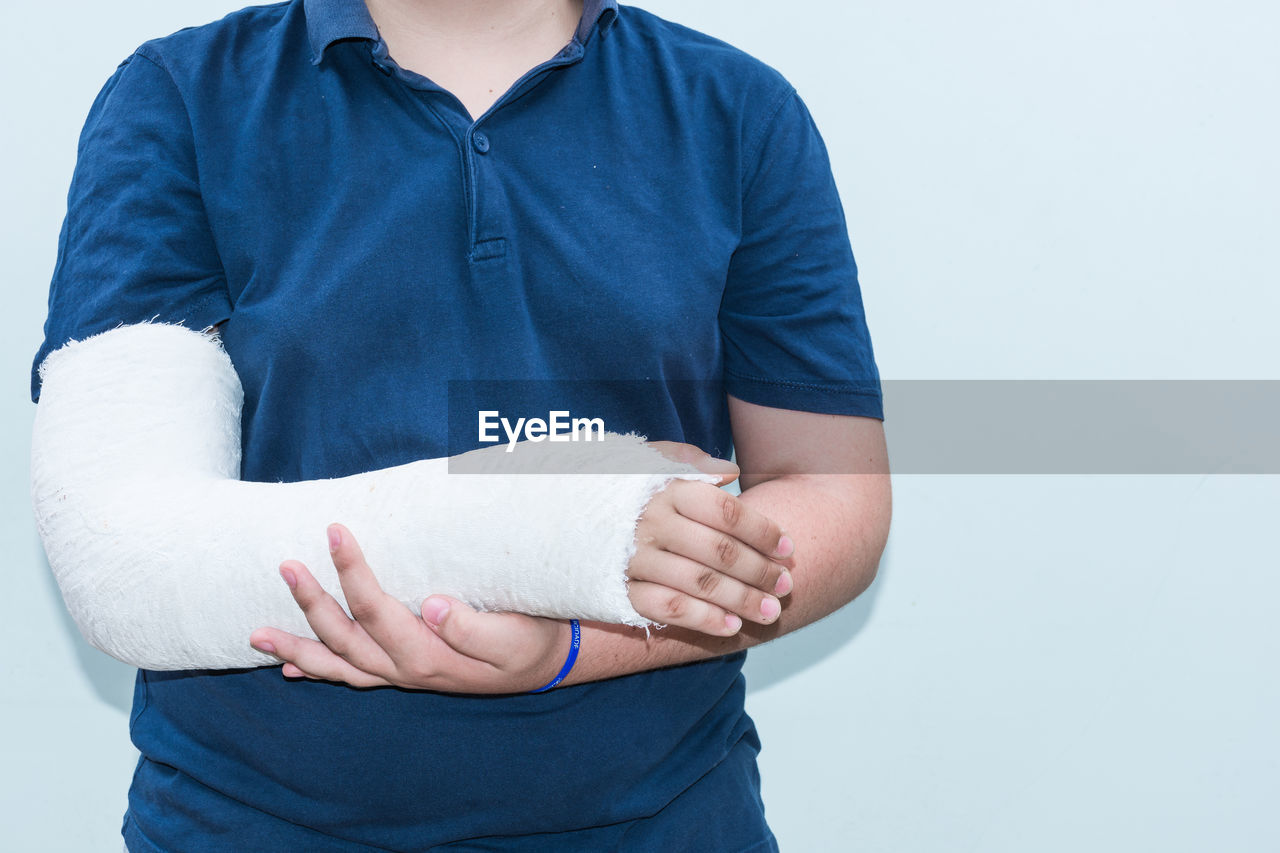 MIDSECTION OF A MAN WITH WHITE BACKGROUND