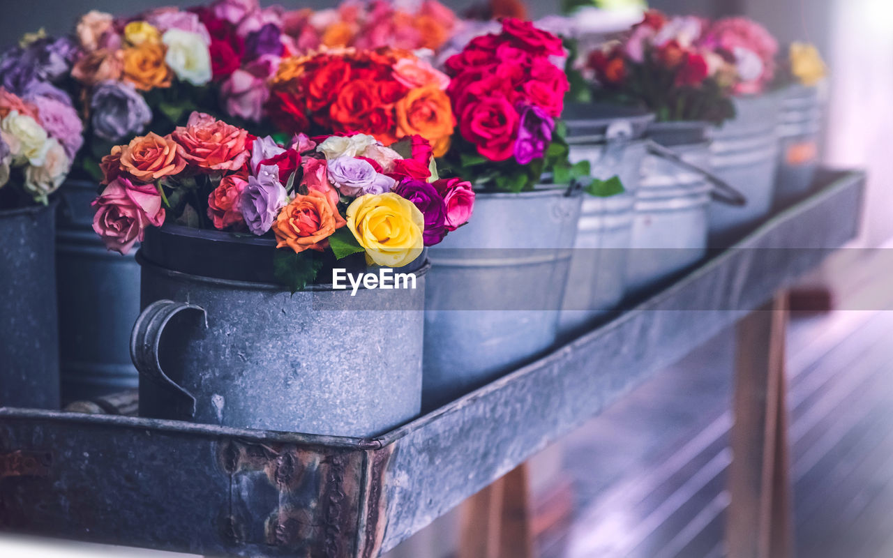 CLOSE-UP OF ROSE BOUQUET IN POT FOR SALE