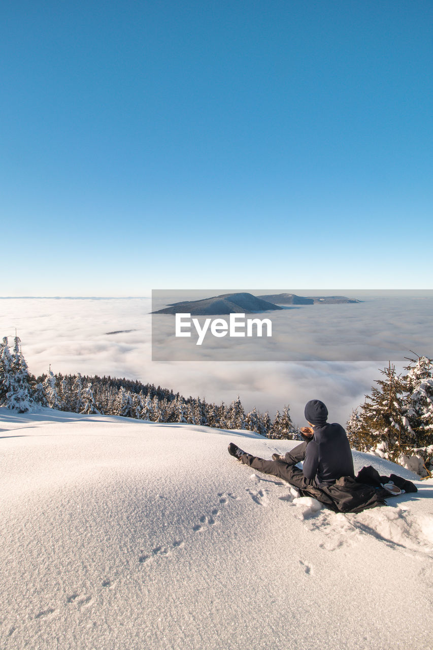 scenic view of snow covered landscape against clear sky