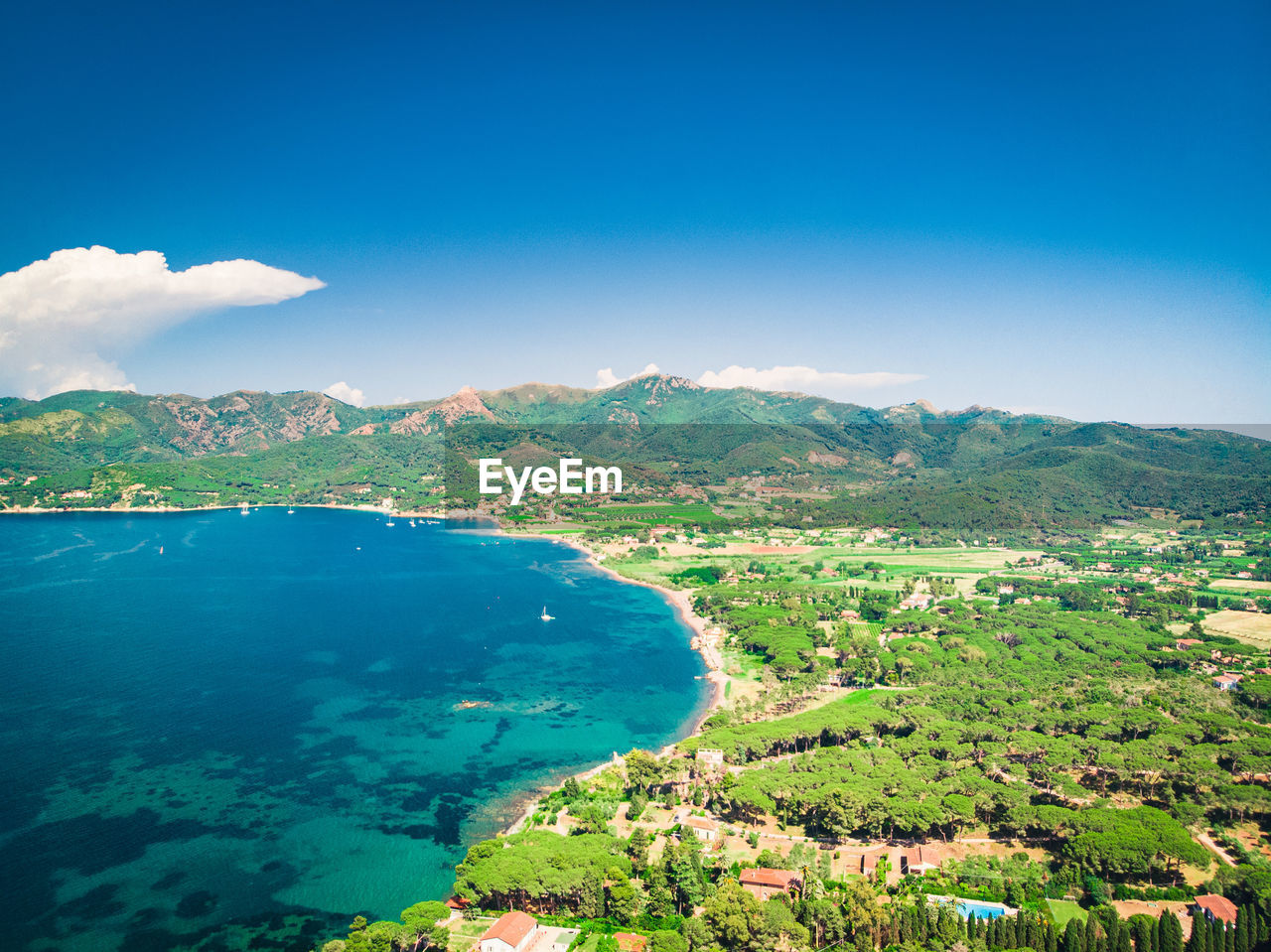 AERIAL VIEW OF BAY AGAINST SKY