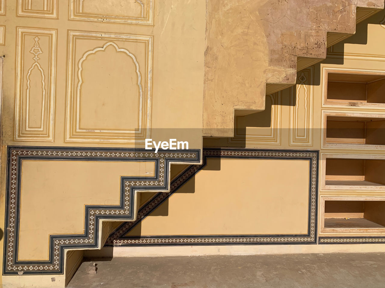 Staircase in the indian fort of nahargarh with reflection over the wall.