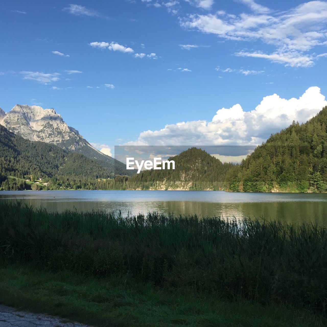 Scenic view of lake and mountains against sky
