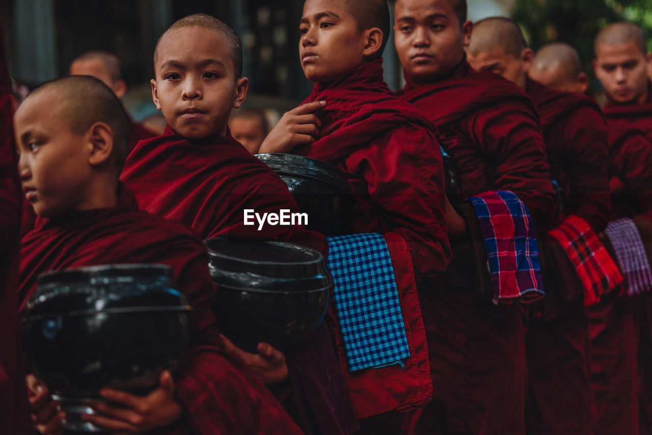 GROUP OF PEOPLE IN TRADITIONAL CLOTHING