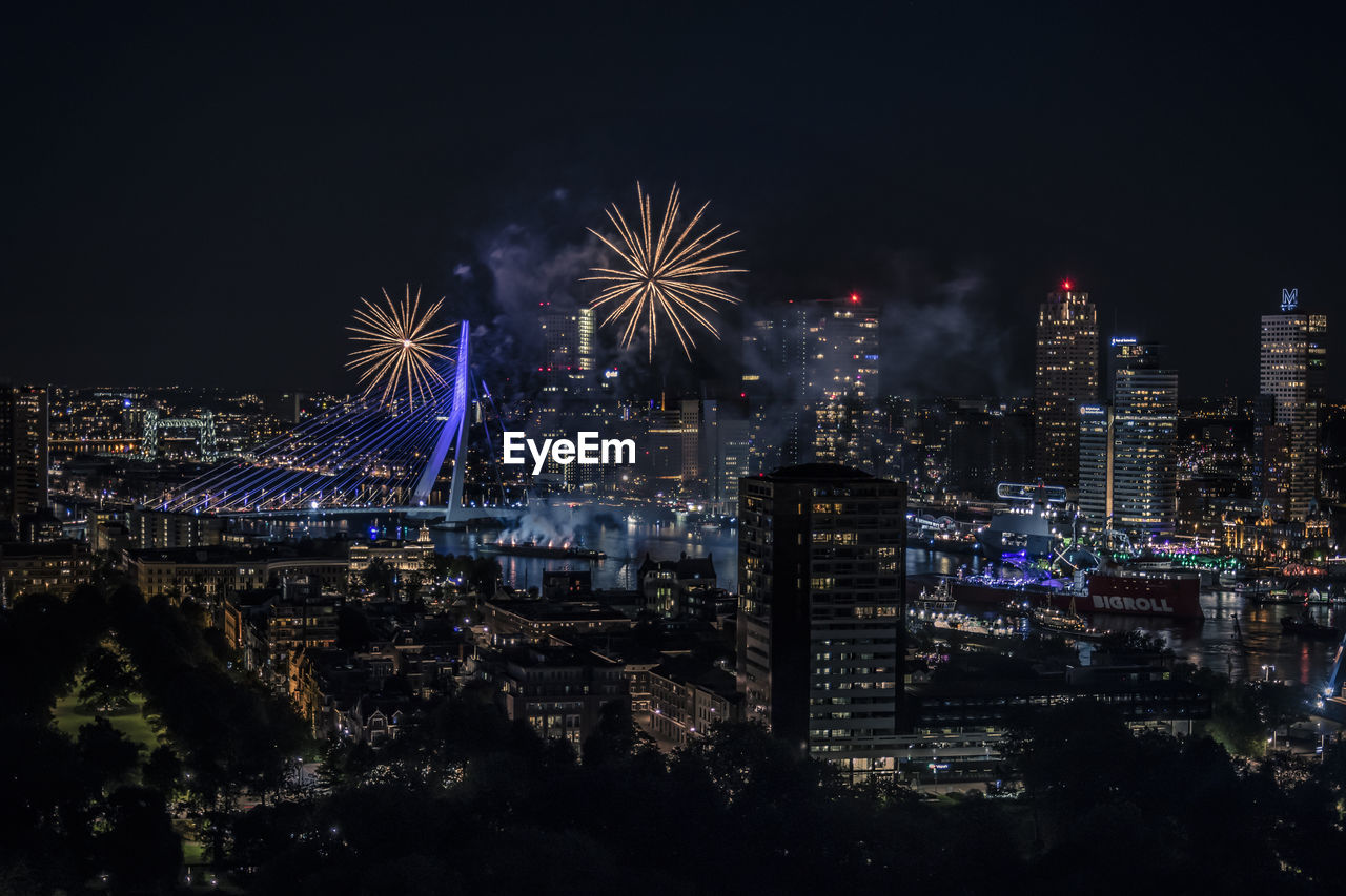 FIREWORK DISPLAY AGAINST SKY AT NIGHT