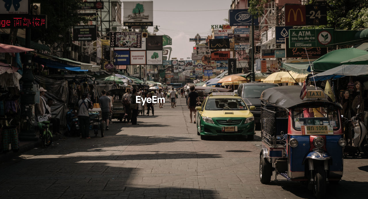 CARS ON STREET IN CITY