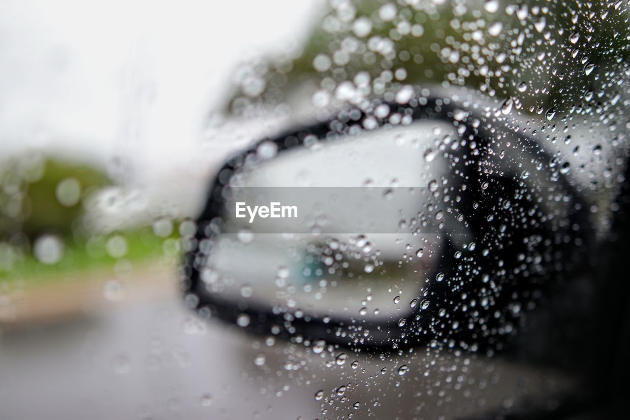 CLOSE-UP OF RAINDROPS ON WINDOW