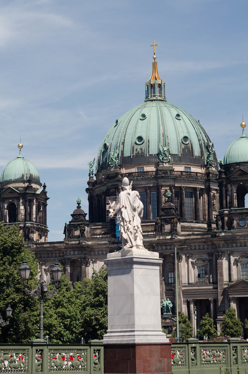 Statue of church in city against sky cathedral 