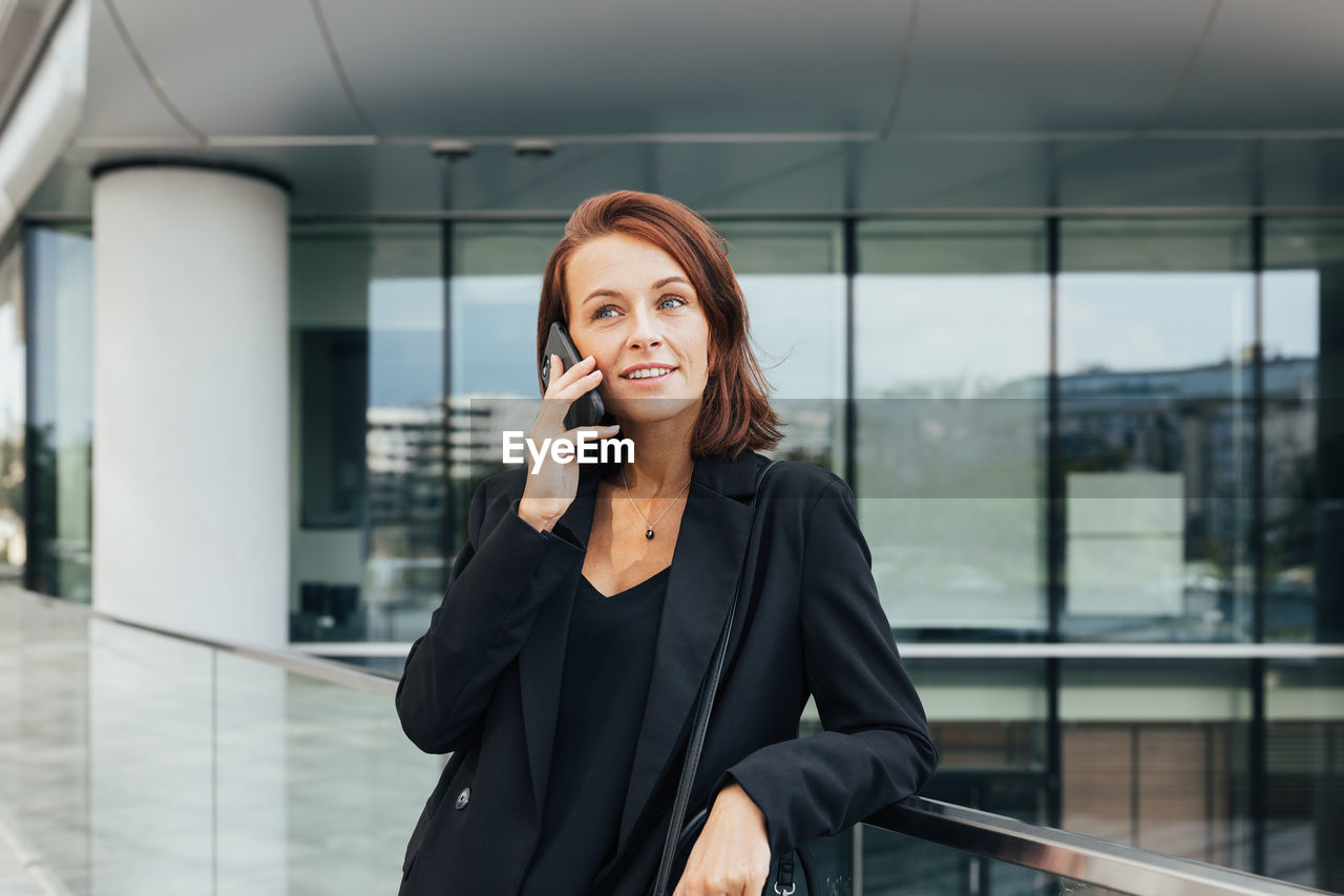 portrait of young woman using mobile phone