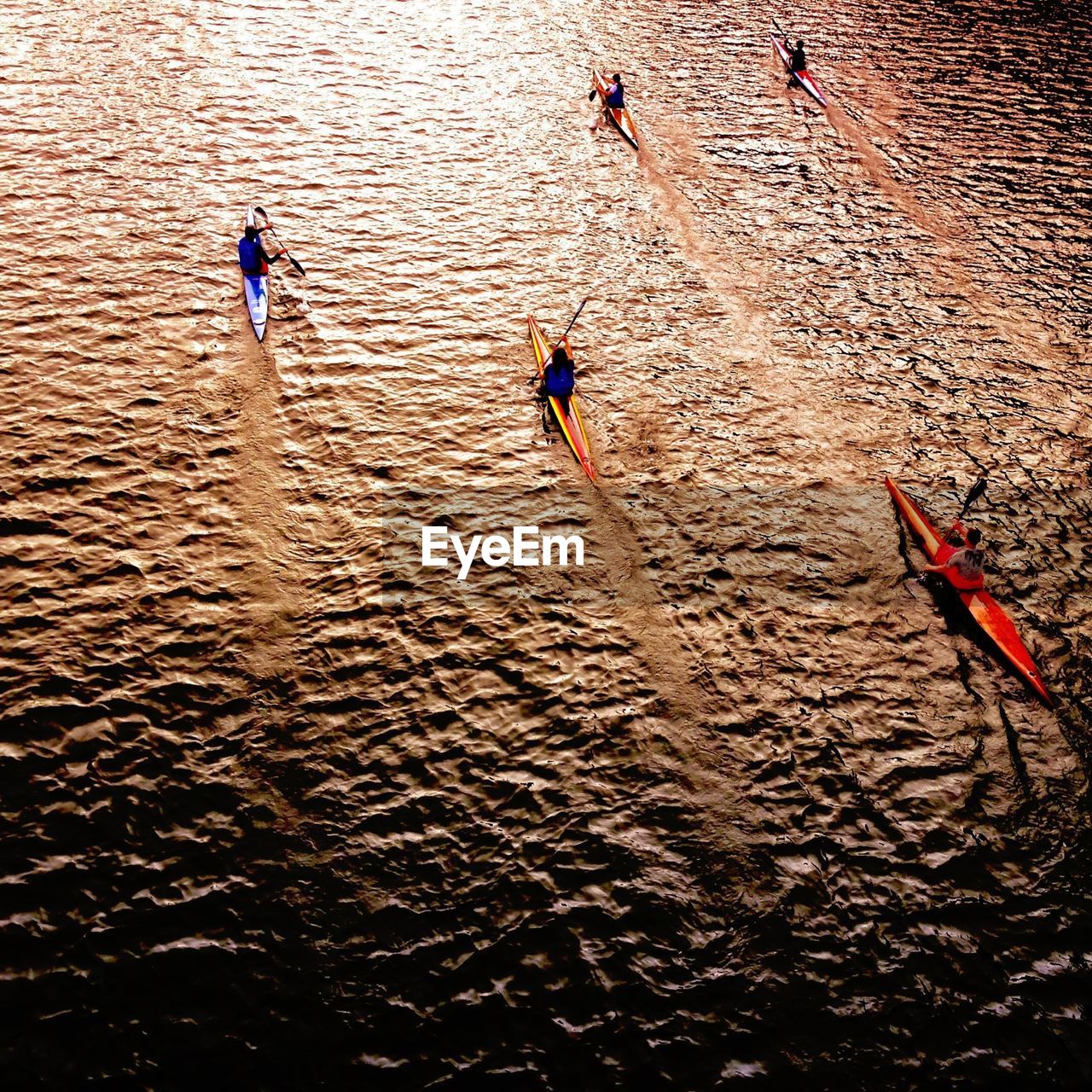 High angle view of people kayaking in river