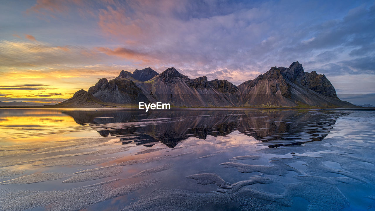 Dramatic evening sunset sky over vestrahorn mountain in stokksnes, iceland