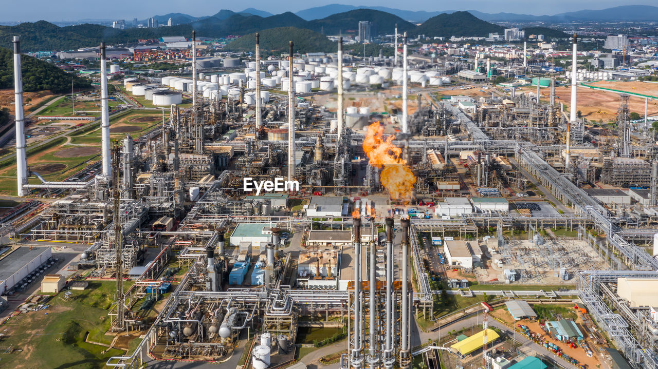 Aerial top view oil and gas refinery petrochemical plant industrial with oil and gas storage tank.