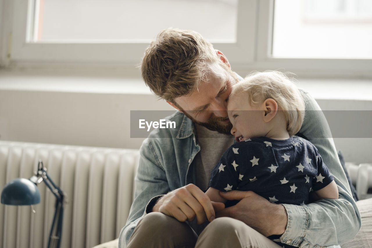 Father spending time with his son at home