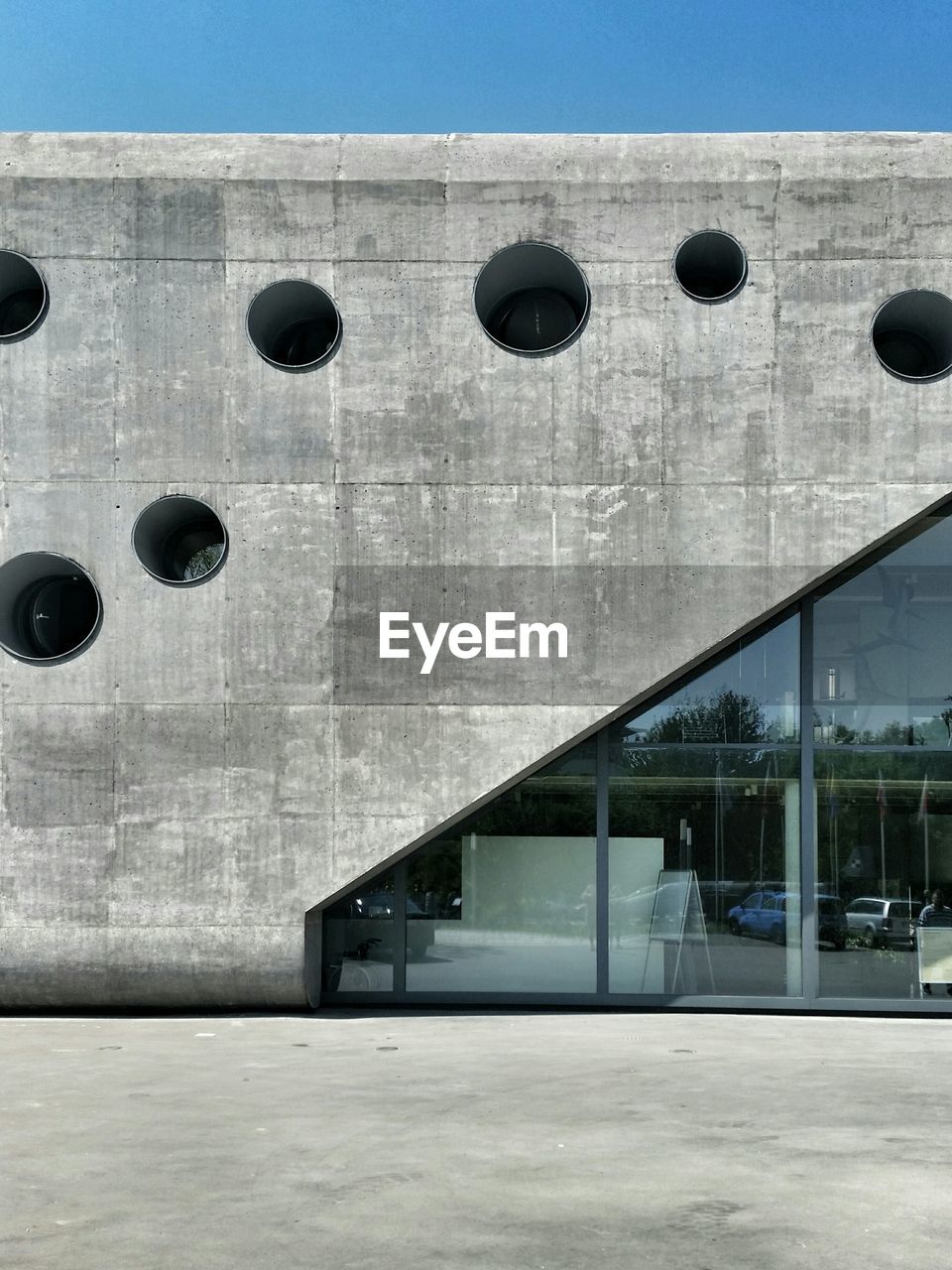 Holes on concrete museum building wall