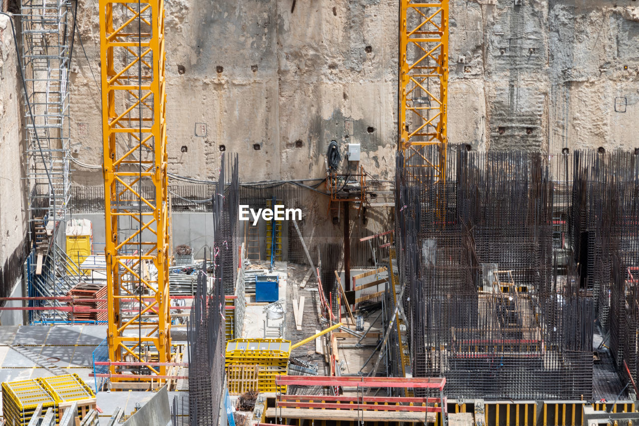 Construction site background. hoisting cranes and new multi storey buildings. industrial background