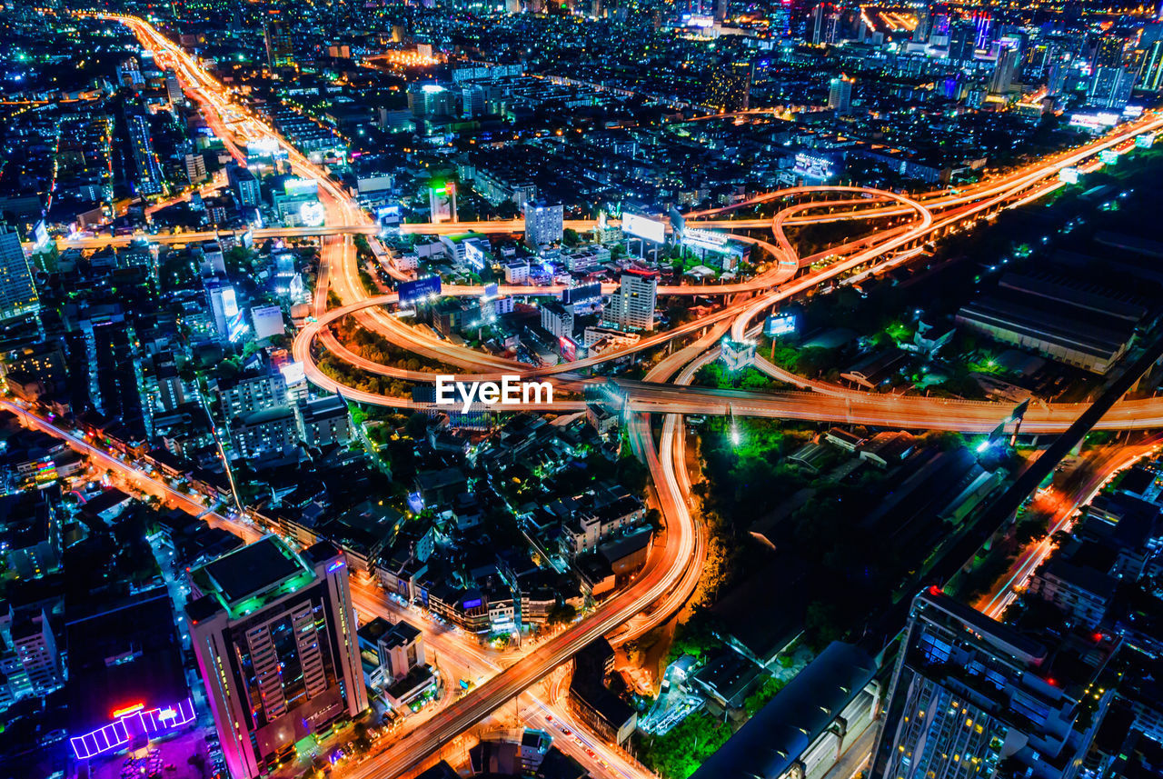 HIGH ANGLE VIEW OF LIGHT TRAILS ON CITY STREET AT NIGHT