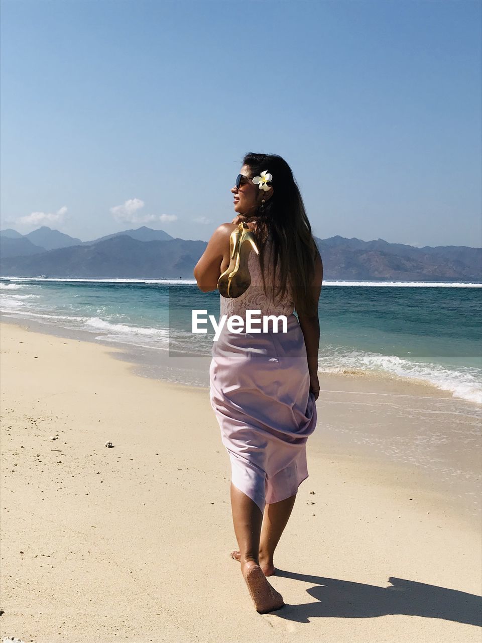 Full length of woman standing on beach