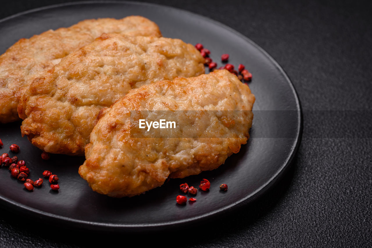 food and drink, food, fried food, meat, dish, studio shot, chicken meat, fried, fast food, produce, no people, healthy eating, freshness, plate, chicken, indoors, black background, meal, fruit, fried chicken, breakfast, wellbeing, close-up, still life