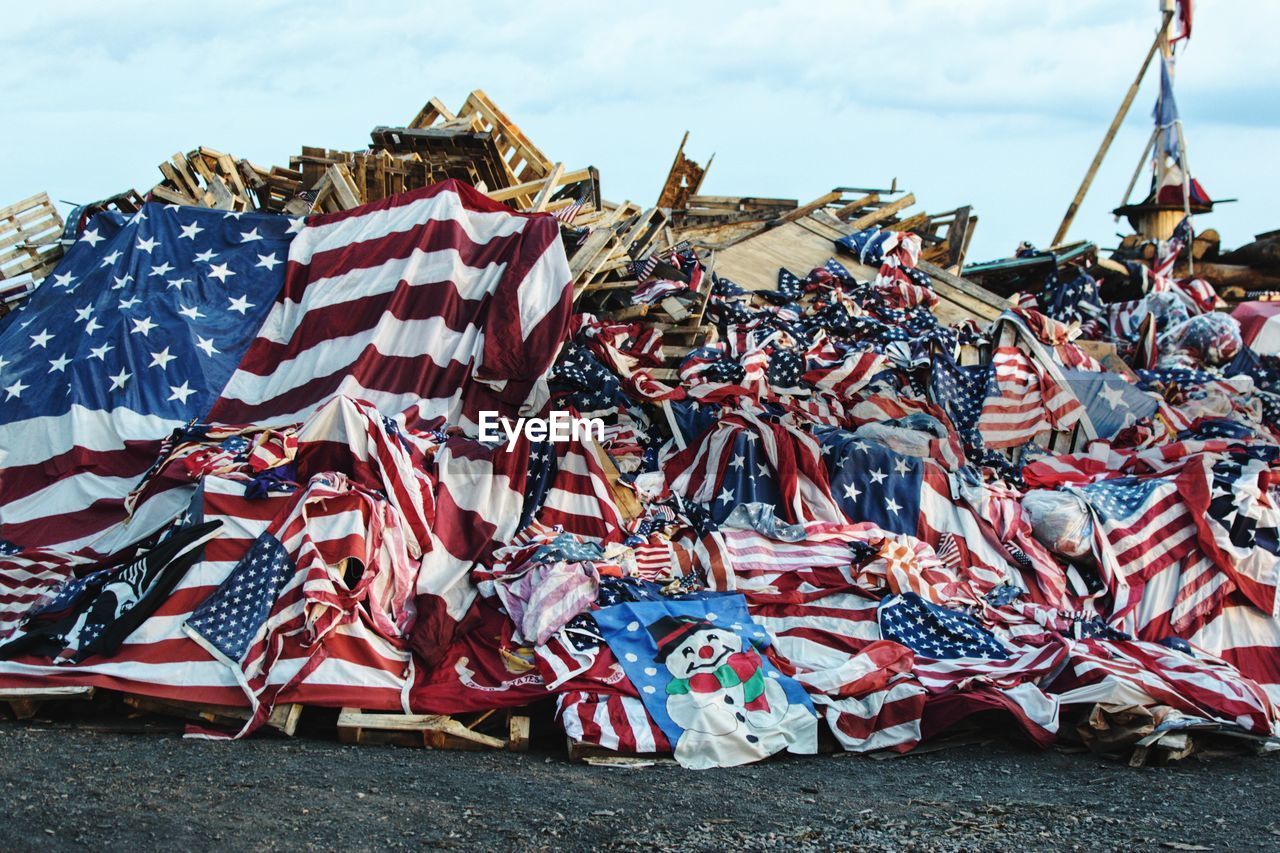 VARIOUS FLAGS ON BEACH