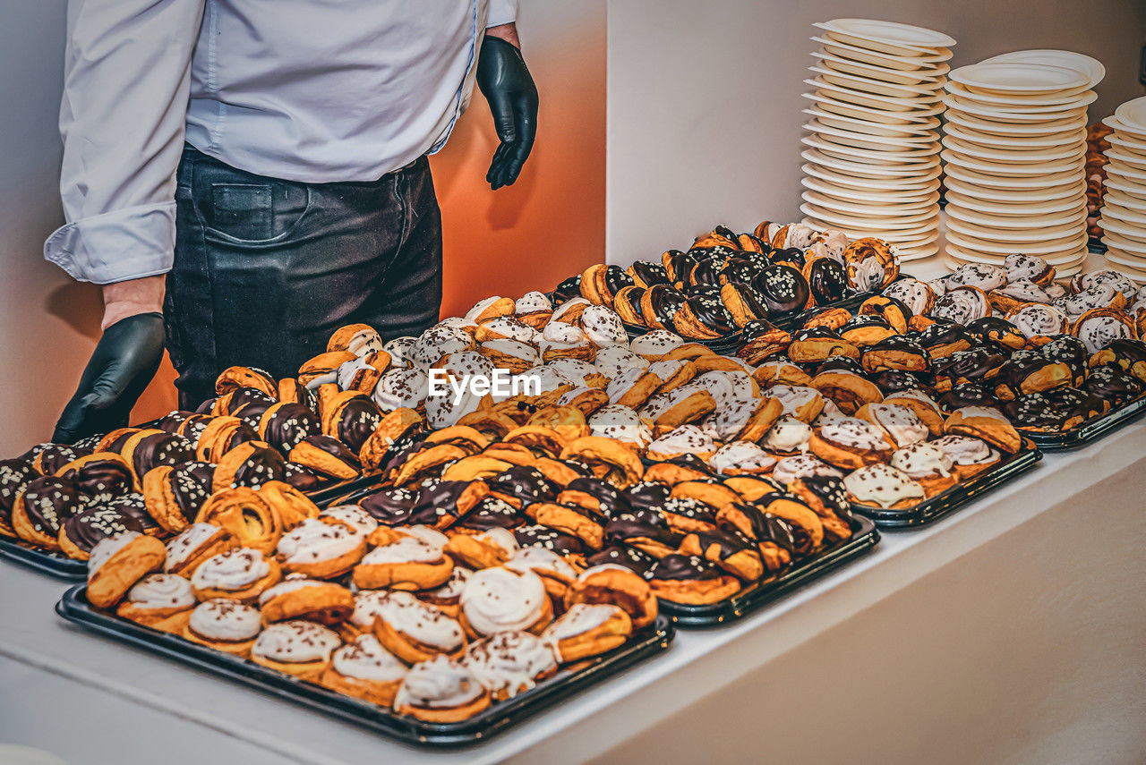 Midsection of man preparing food