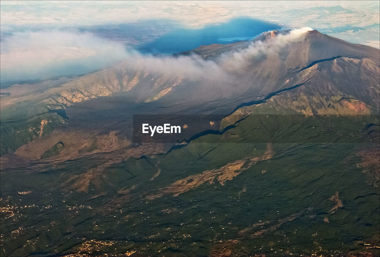 HIGH ANGLE VIEW OF ILLUMINATED MOUNTAIN