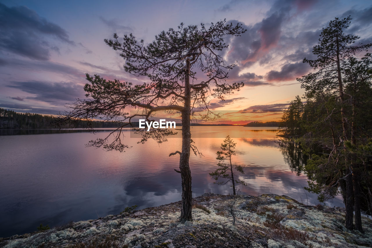 SCENIC VIEW OF LAKE AGAINST ORANGE SKY