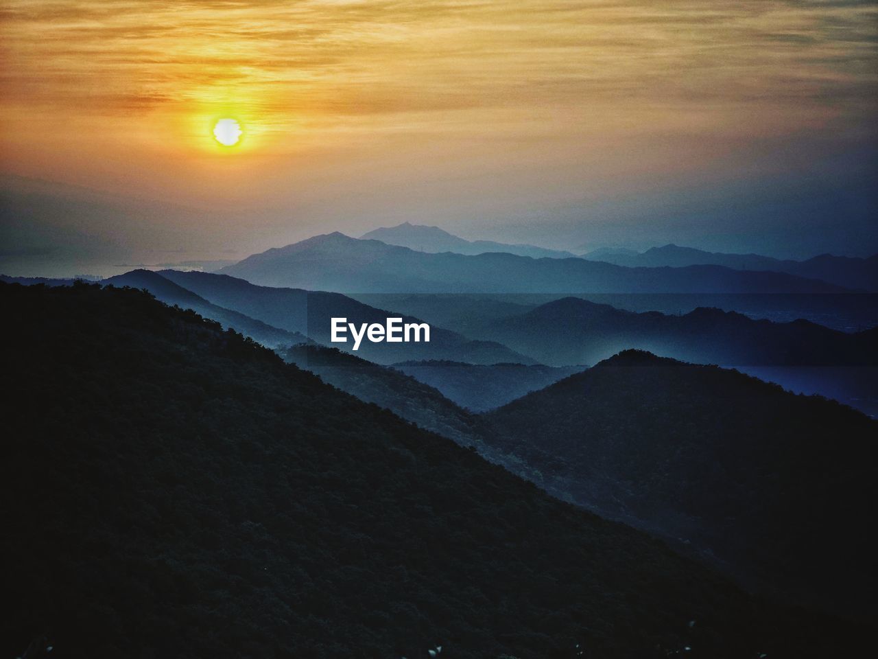 SCENIC VIEW OF MOUNTAINS AGAINST SKY DURING SUNSET