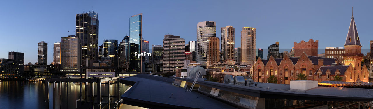 View of skyscrapers against clear blue sky