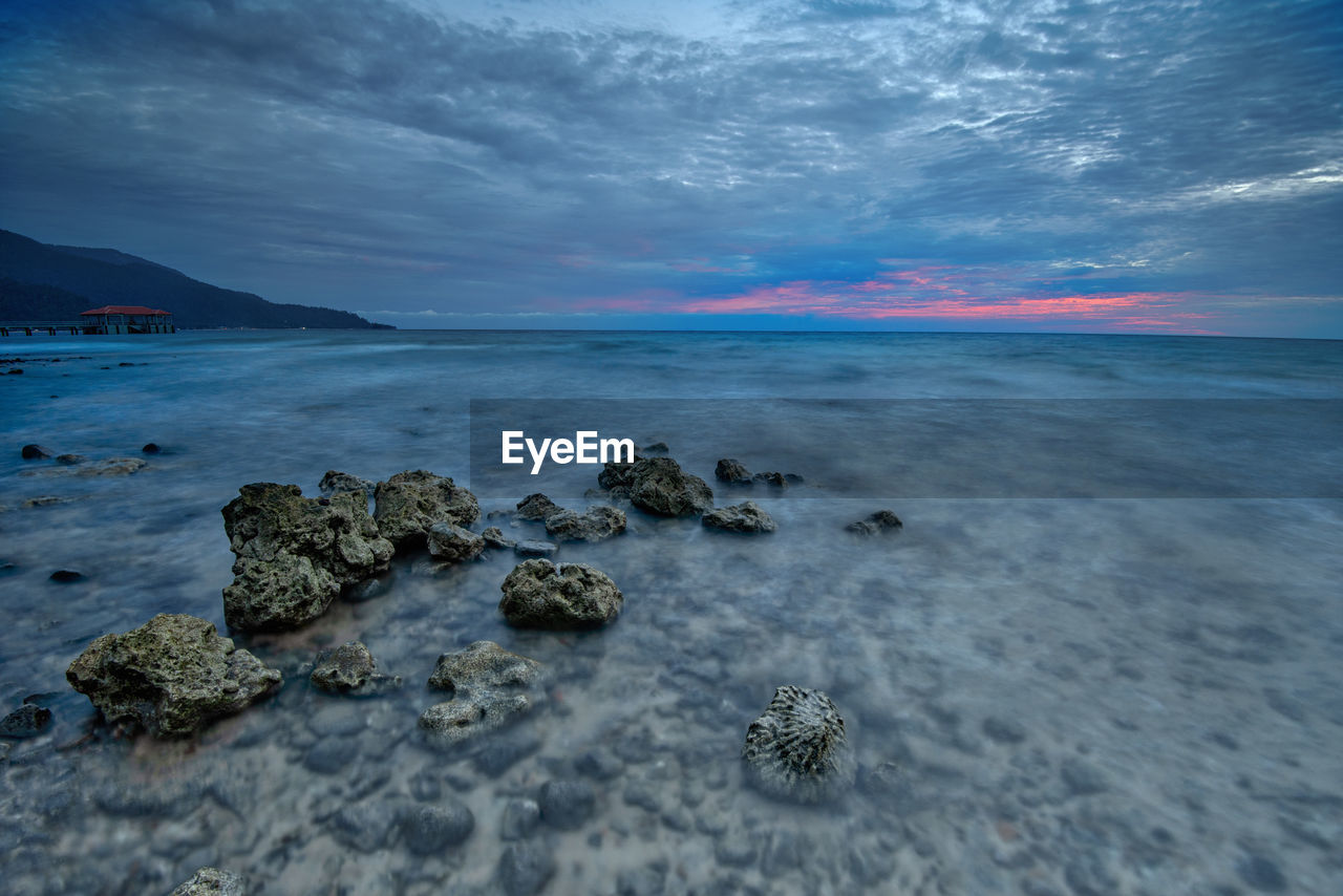 Scenic view of sea against sky during sunset