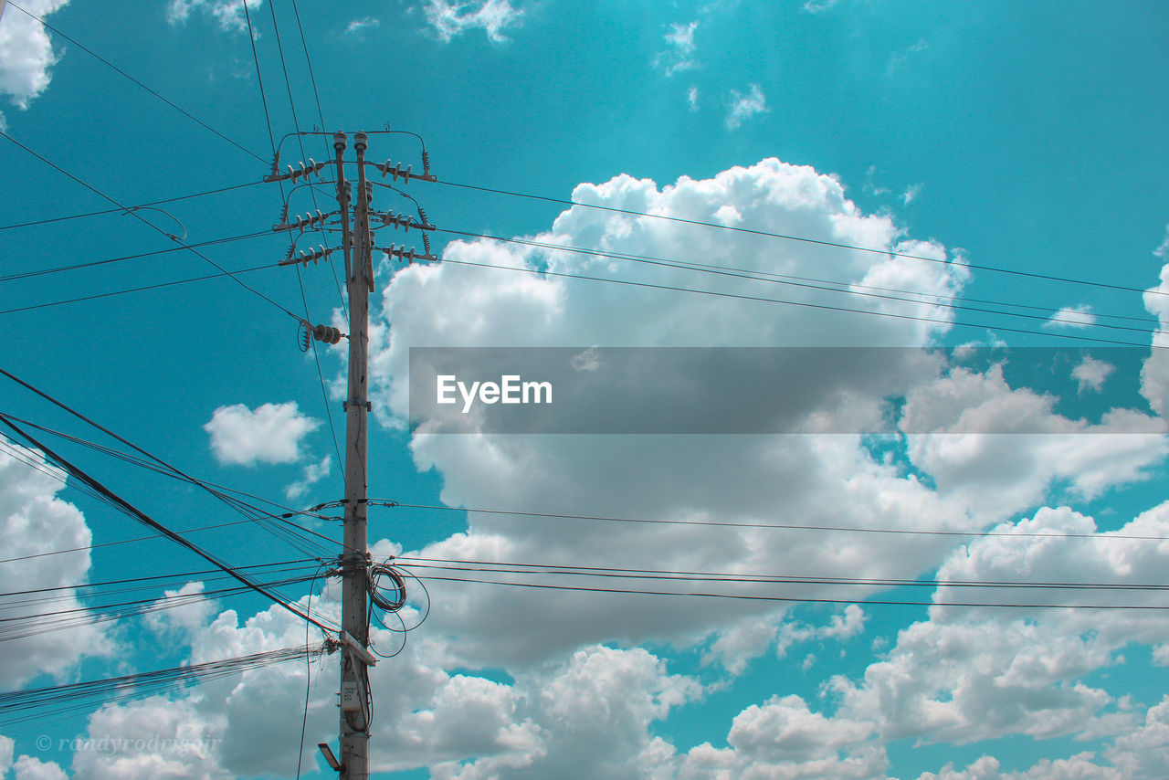 Low angle view of power lines against sky