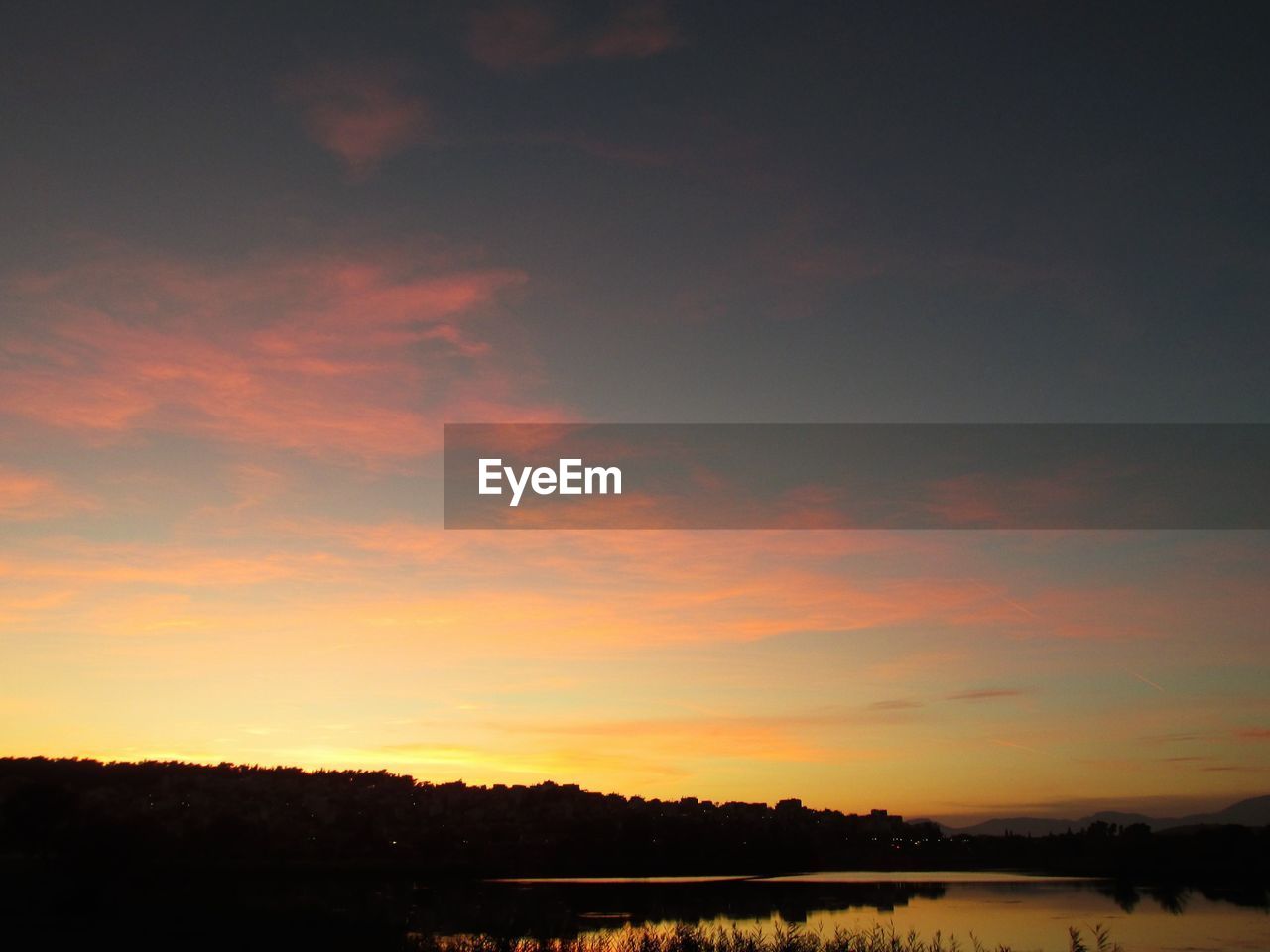 SILHOUETTE LANDSCAPE AGAINST SKY DURING SUNSET