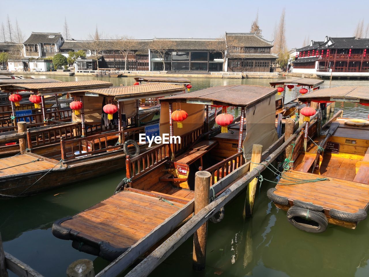 High angle view of boats moored in canal amidst buildings in city