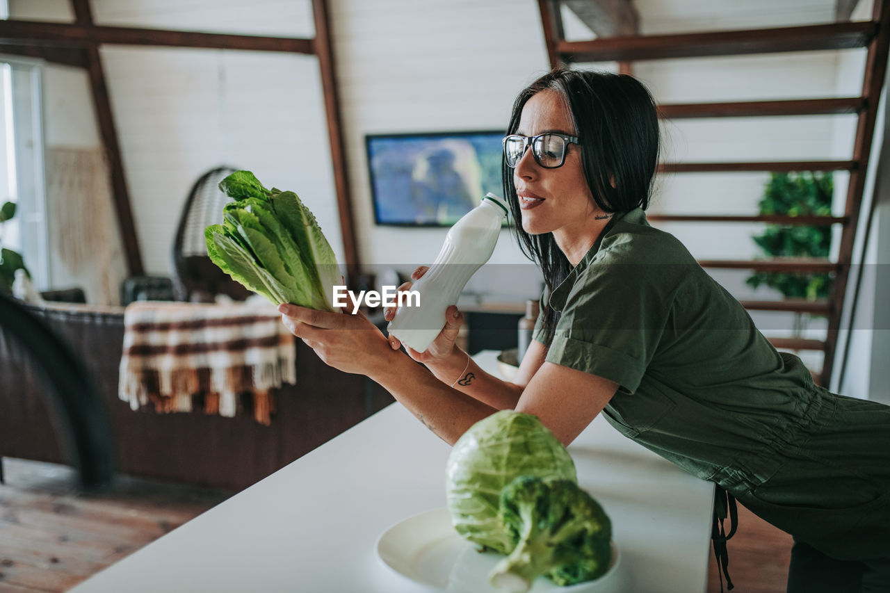 Woman holding food on table