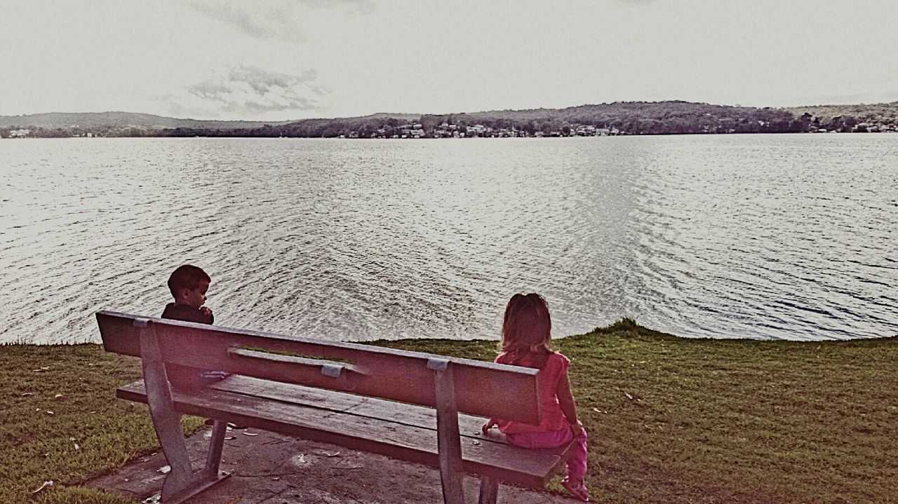 WOMAN SITTING ON BENCH