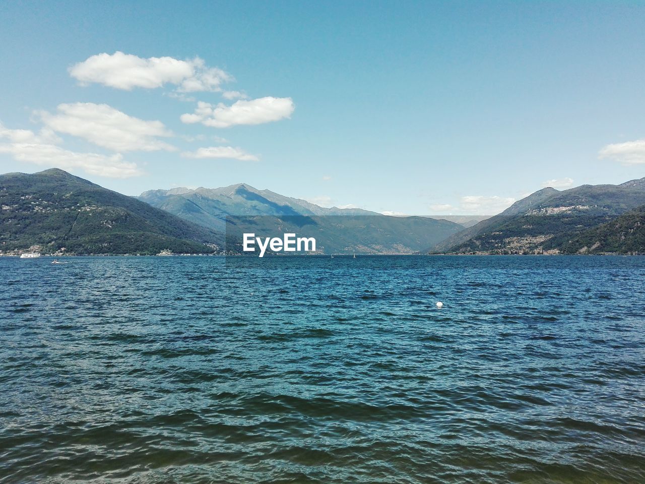 Scenic view of mountains against cloudy sky