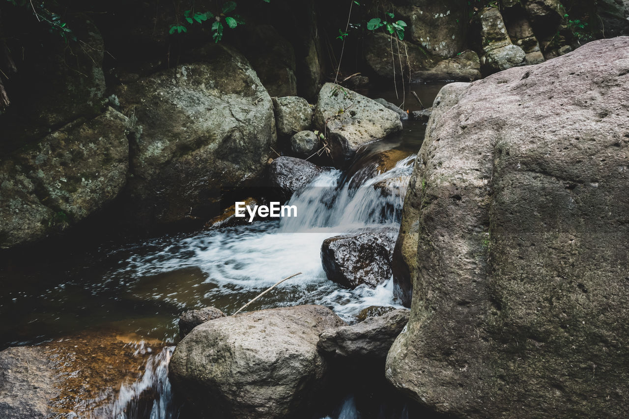 STREAM FLOWING THROUGH ROCKS