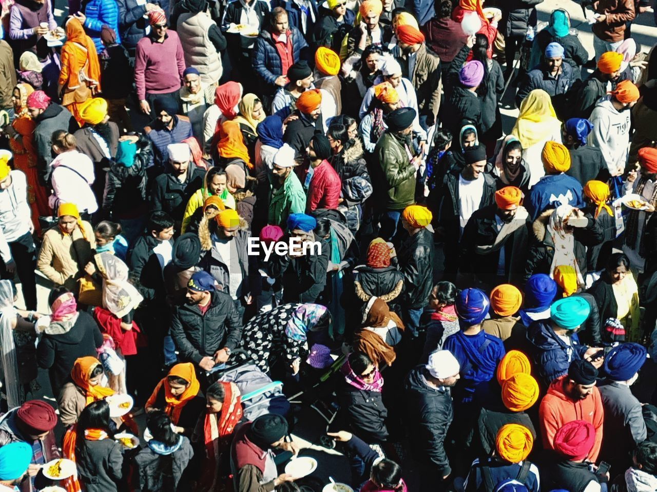 HIGH ANGLE VIEW OF PEOPLE AT MARKET