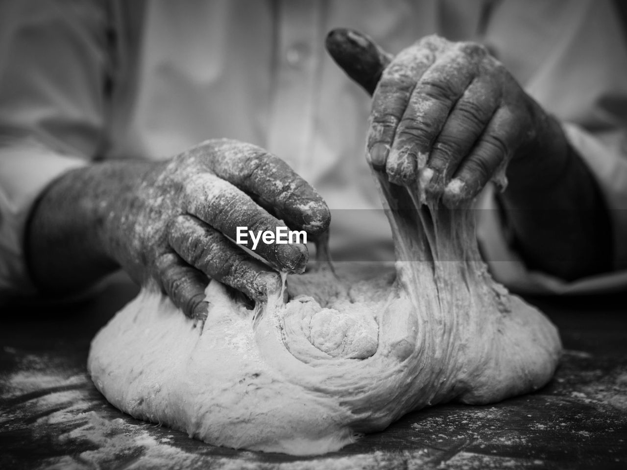 CLOSE-UP OF PERSON PREPARING MEAT