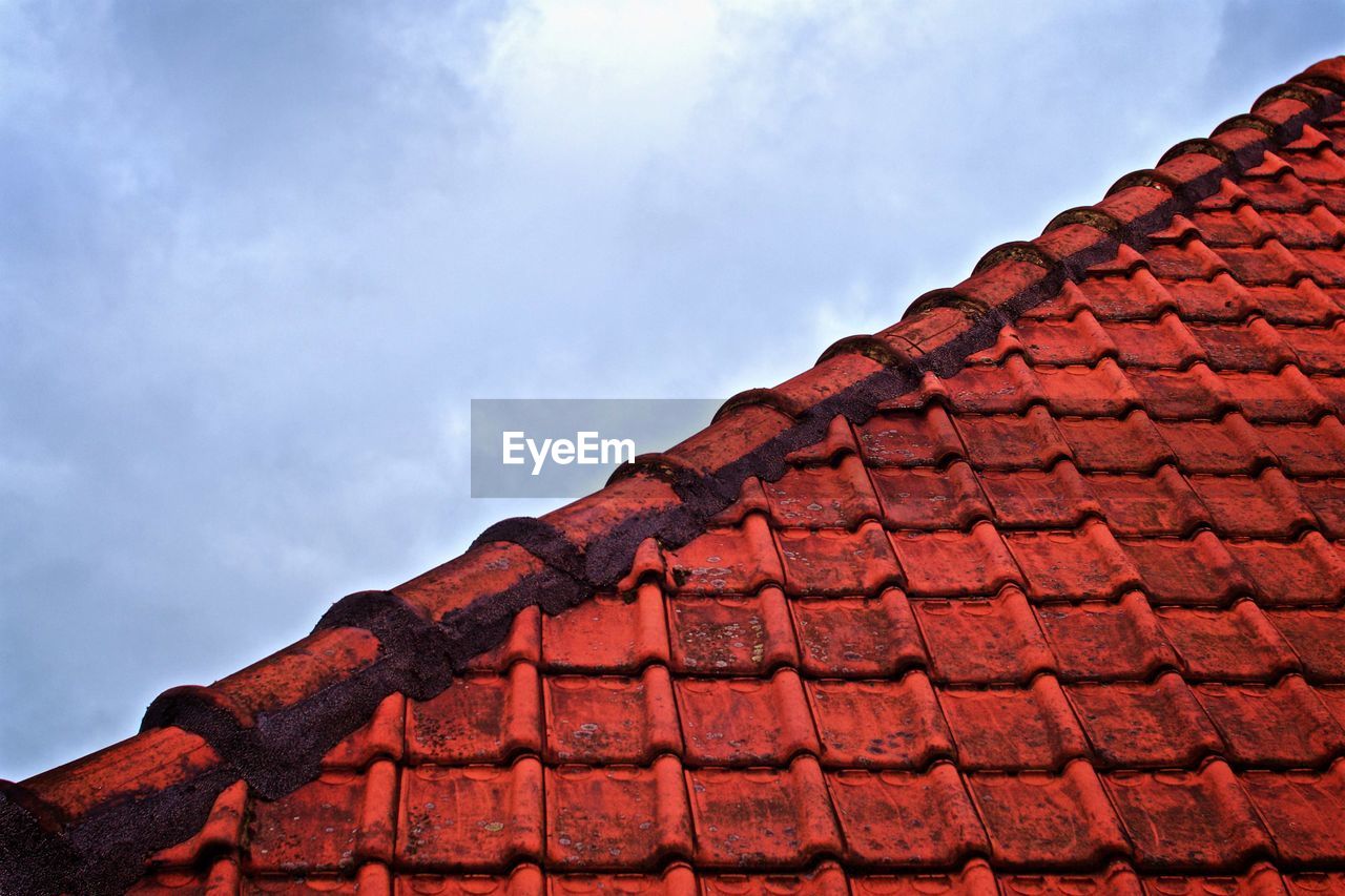 VIEW OF ROOF TILES AGAINST SKY