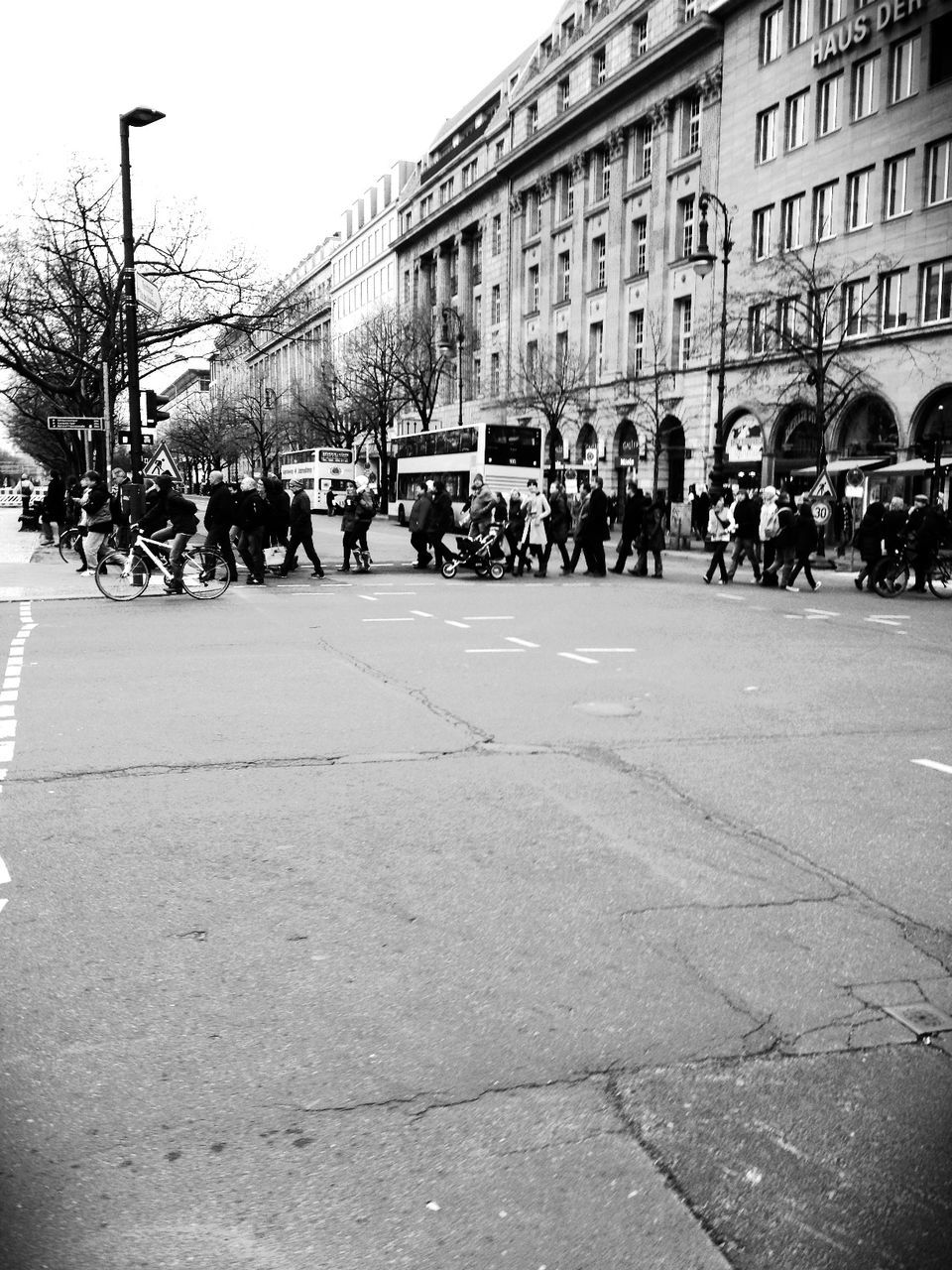 PEOPLE WALKING ON STREET IN CITY