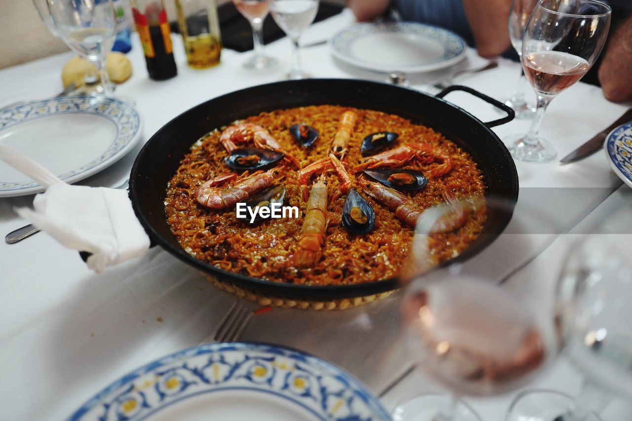 High angle view of paella in plate on table
