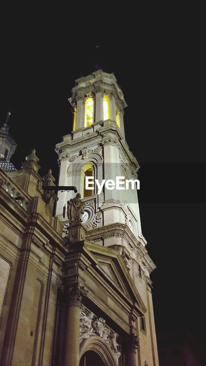 LOW ANGLE VIEW OF CHURCH AT NIGHT
