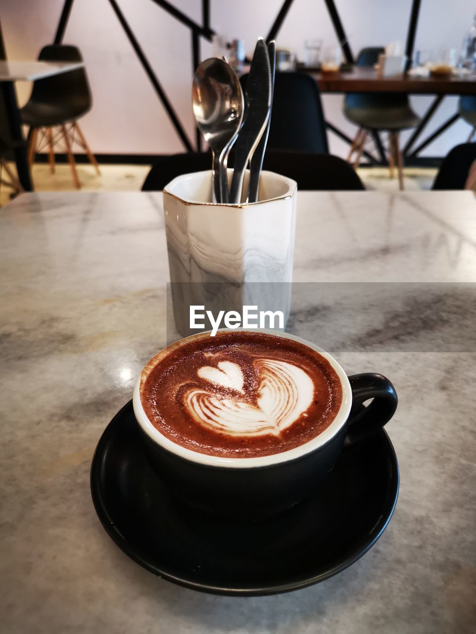 CUP OF COFFEE ON TABLE