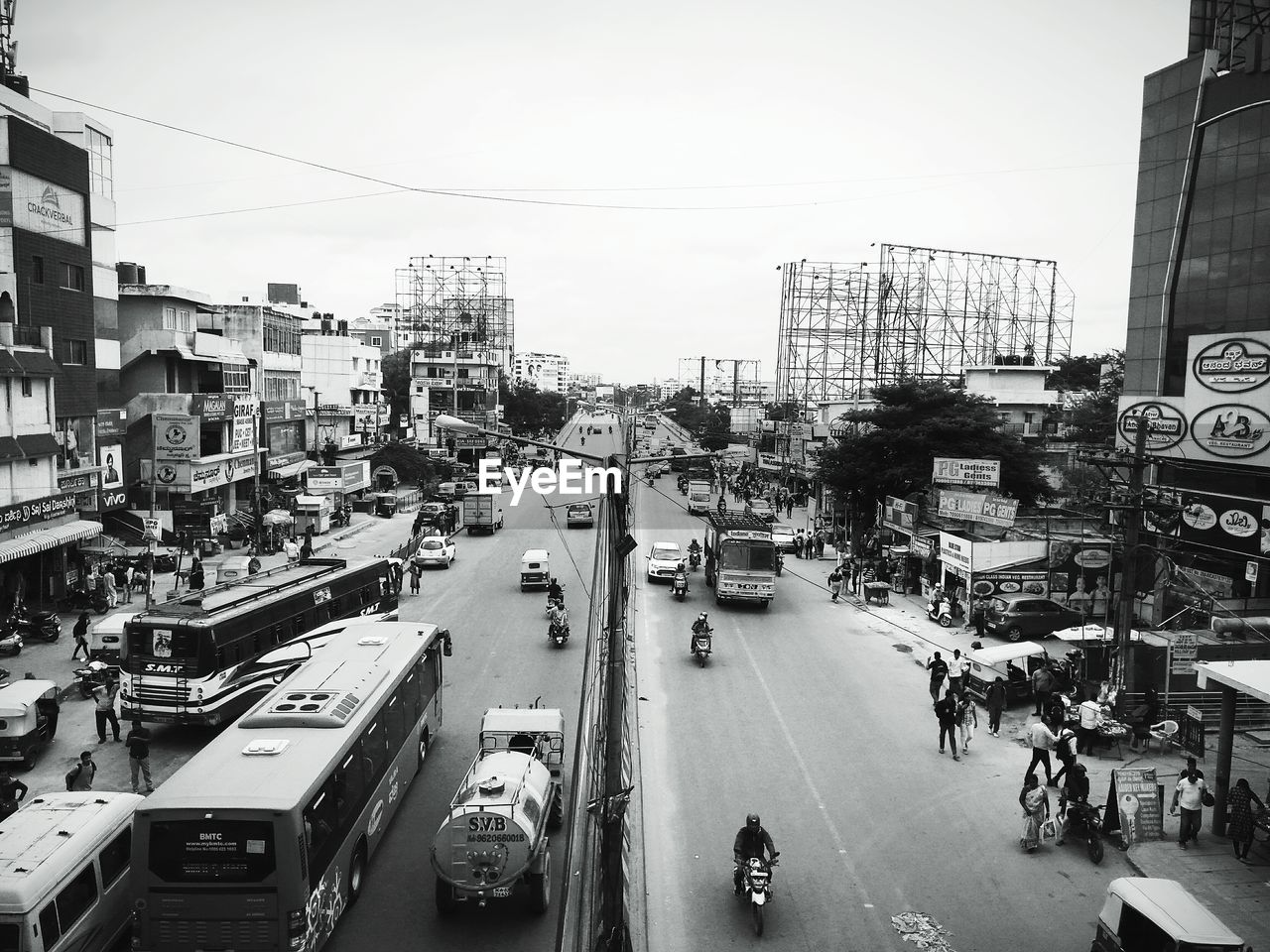 High angle view of city street and buildings against sky