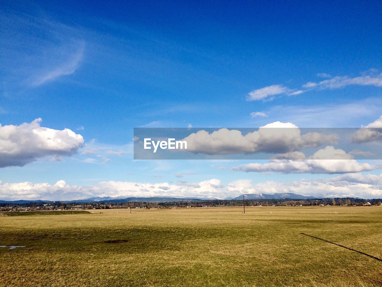 SCENIC VIEW OF LANDSCAPE AGAINST BLUE SKY