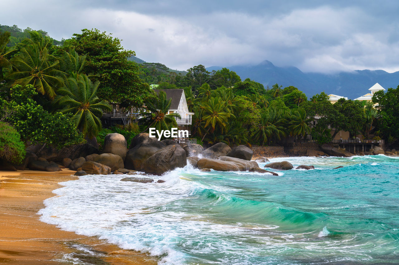 scenic view of waterfall against sky