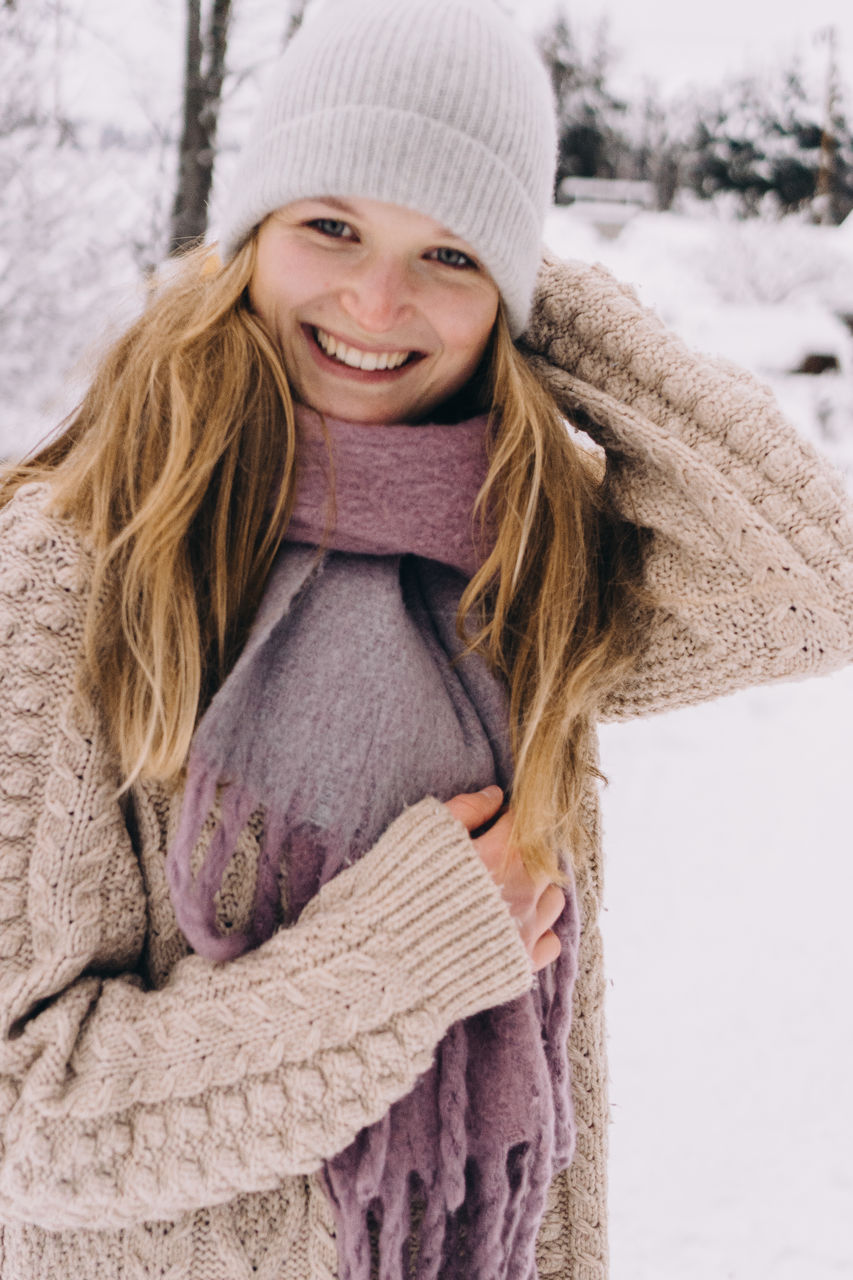 Portrait of a smiling young woman in winter