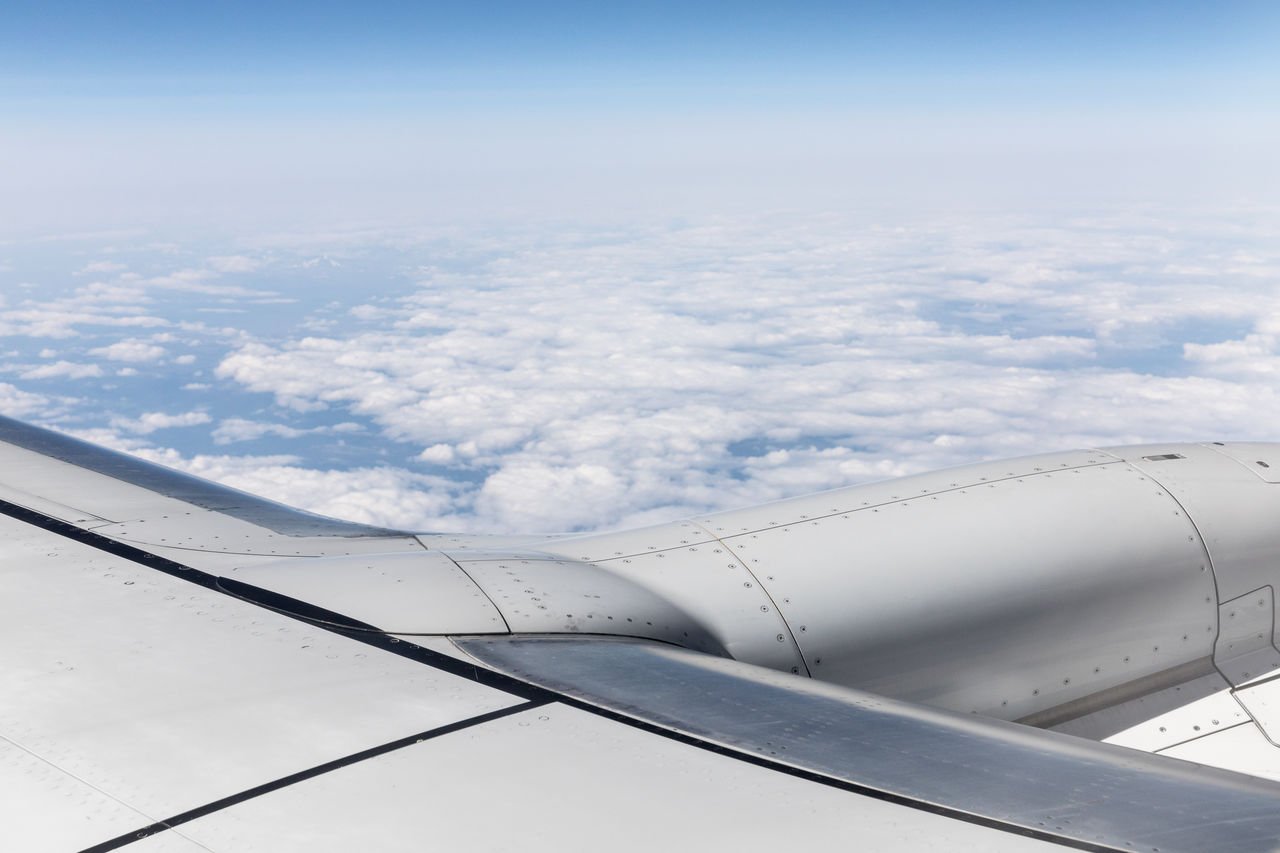 AERIAL VIEW OF CLOUDS OVER AIRPLANE WING