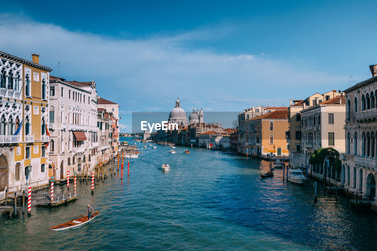 Grand canal amidst buildings against sky