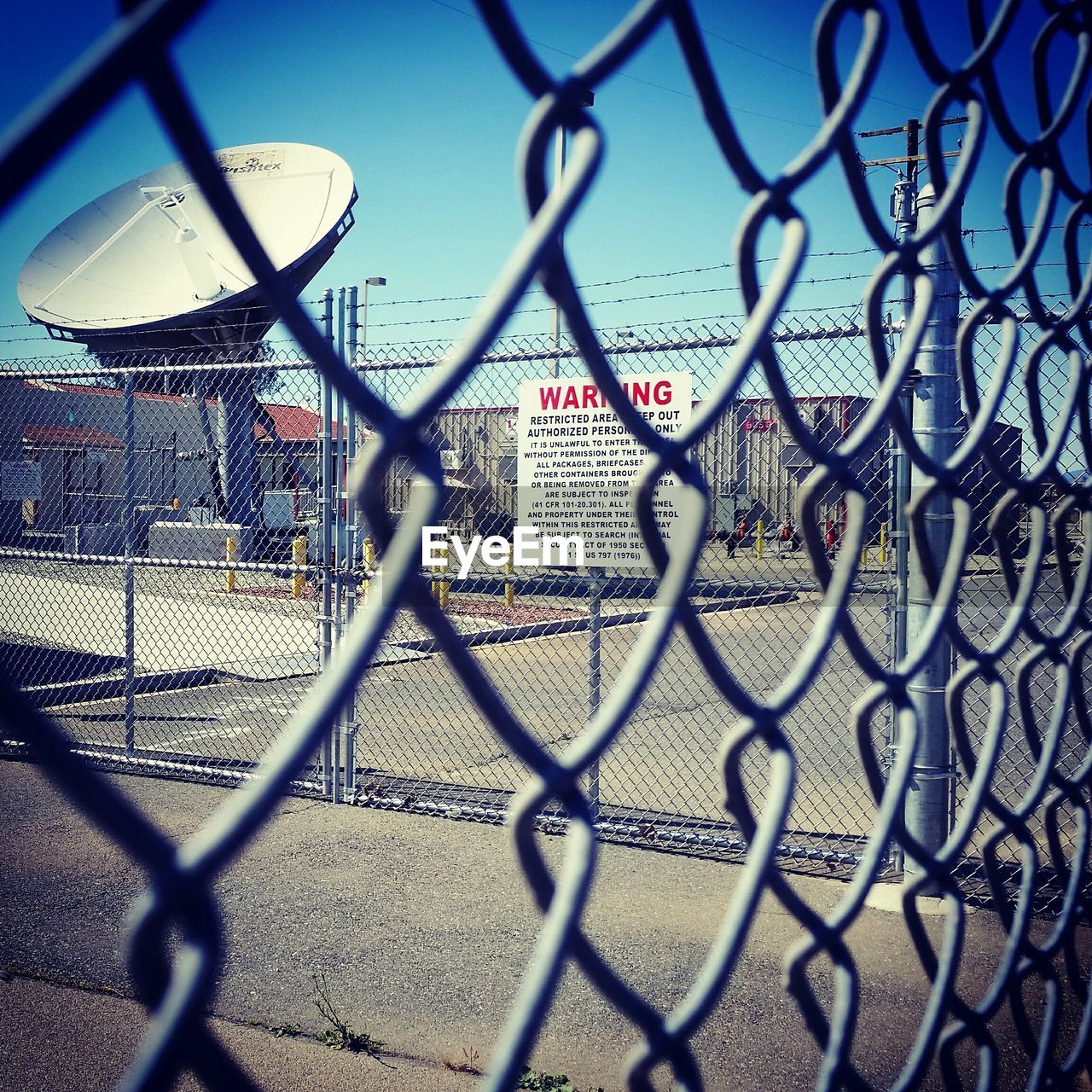 Close-up of fence at military base