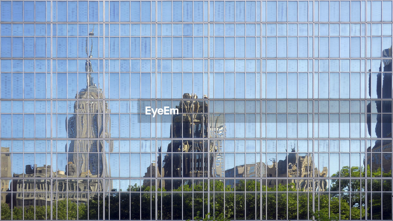 Reflection of buildings on glass in city